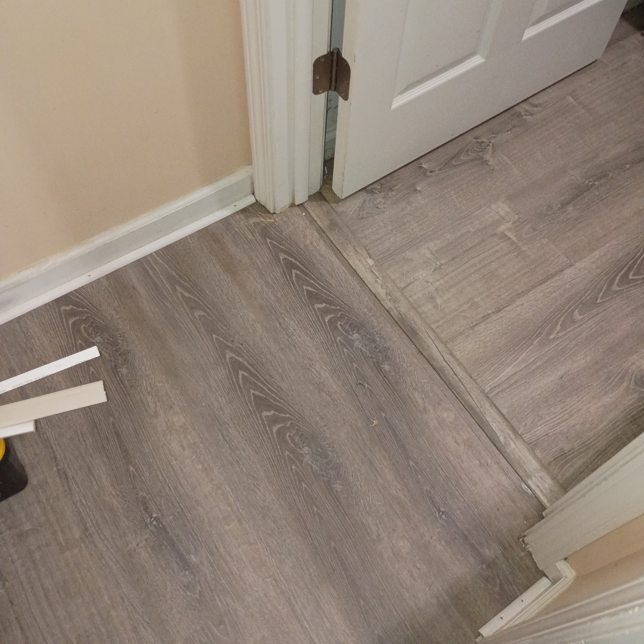 Finished gray wood-look flooring installation